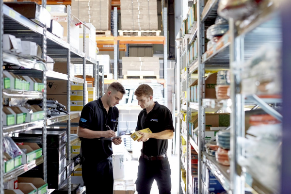 Two of the Foster Industrial team inspecting stock in their stockroom in shepshed where we managed their sales recruitment